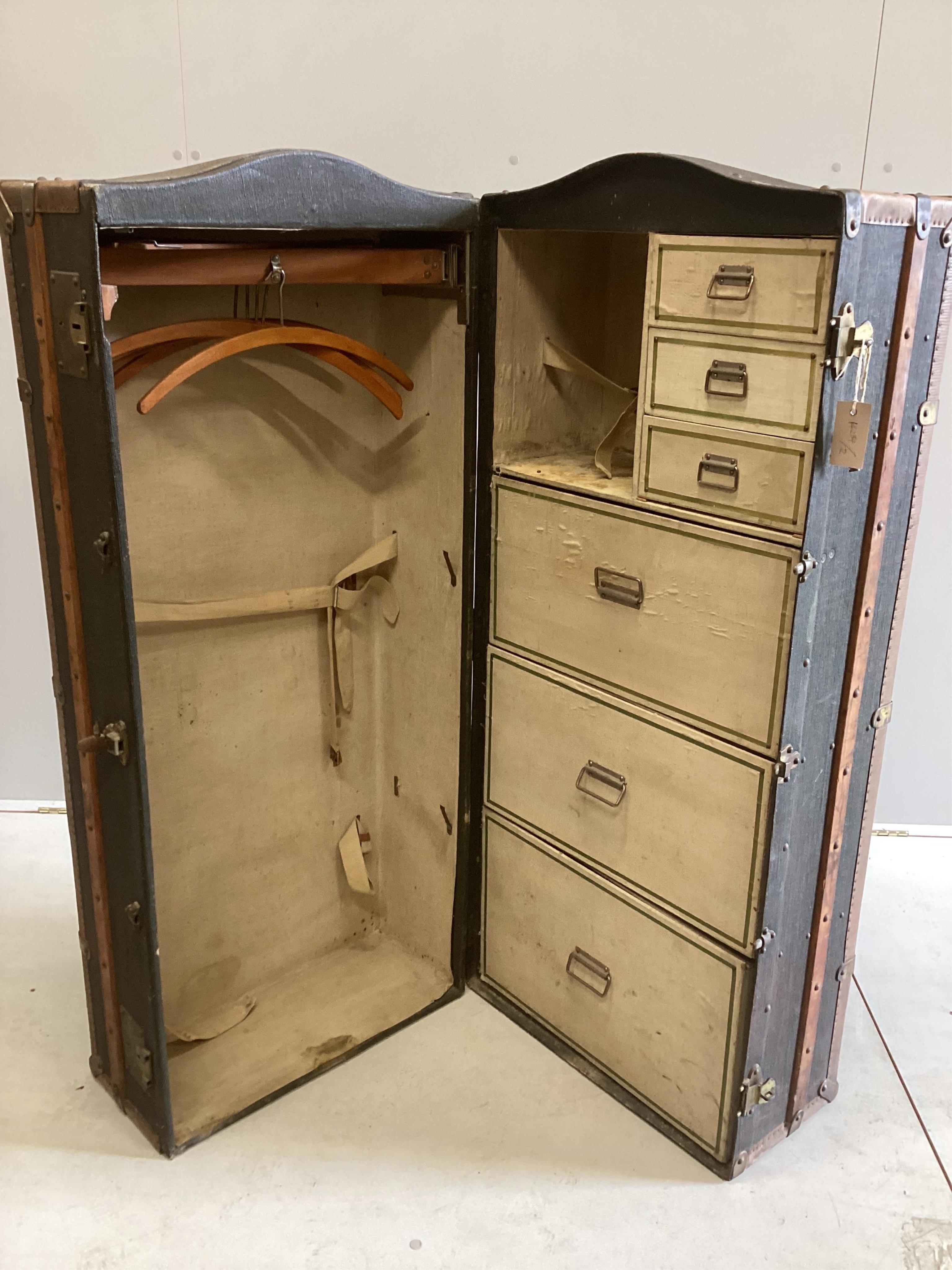 A Victorian wardrobe trunk, width 52cm, depth 55cm, height 130cm